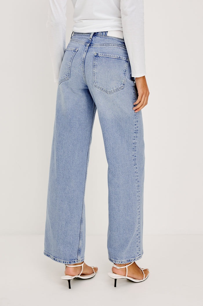 Getty Wide Leg Jean in Light Stretch Denim With High-Rise High-Waisted Fit, Button Fly, and 5-Pocket Styling in Jasper Colorway - Lower Body Back View Featured on Model