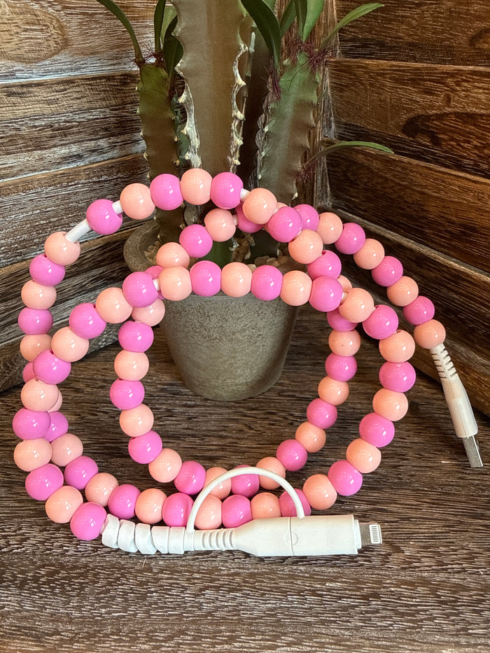 Beaded USB-C phone charger with pink and peach bead strands and white USB-C tip