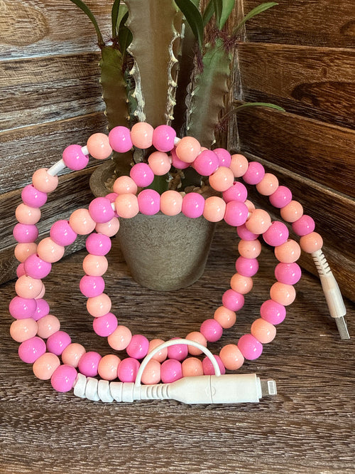 Beaded USB-C phone charger with pink and peach bead strands and white USB-C tip