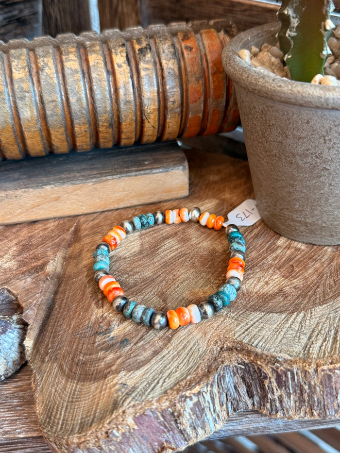 Stretch bracelet with turquoise blue and orange spiny oyster bead accents
