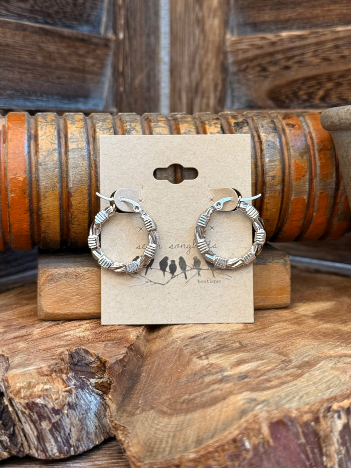 Silver barbed-wire hoop stud earrings in stainless steel, textured circular hoops