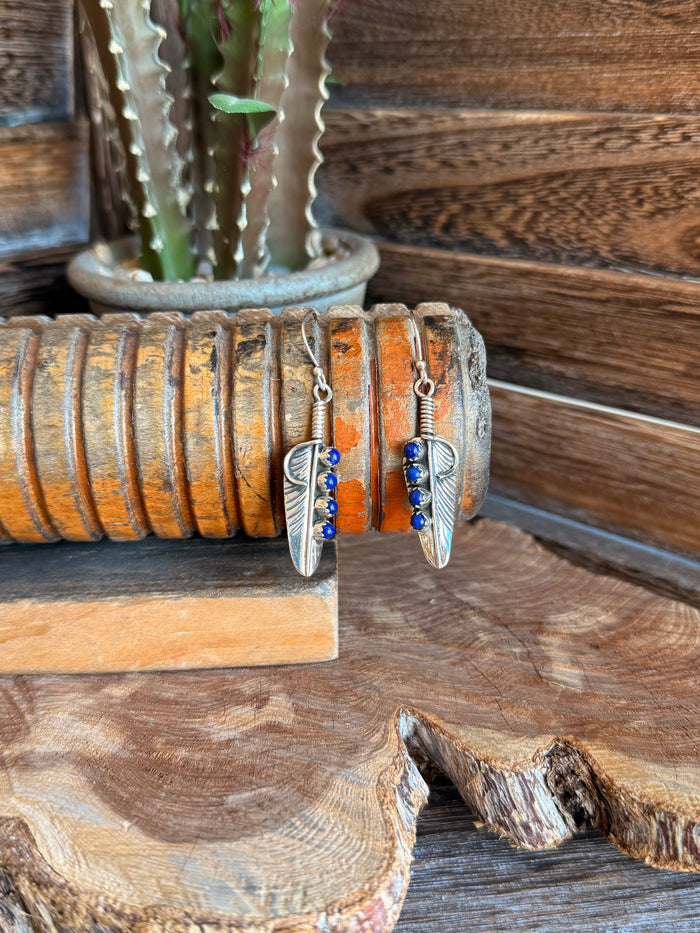 Silver lapis feather fishhook earrings with blue bead dangles