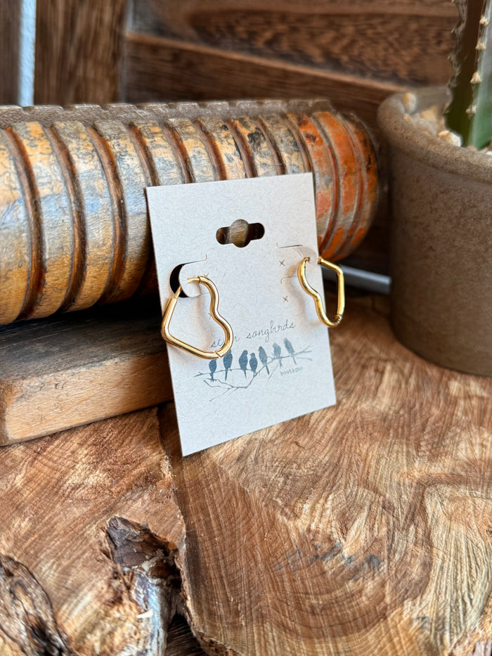 Gold-plated heart stud earrings on display card, minimal outline design