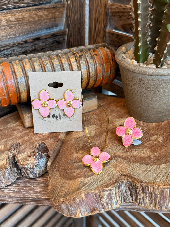 Pink floral stud earrings with gold-tone centers, on display card, with thin necklace chain