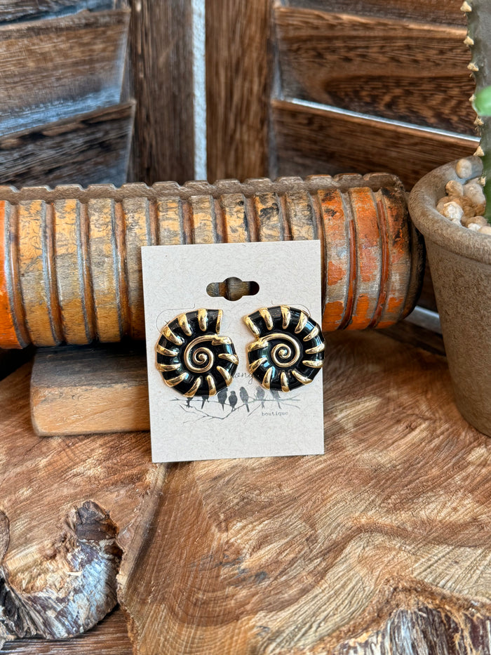Black and gold shell stud earrings with spiral swirl detailing