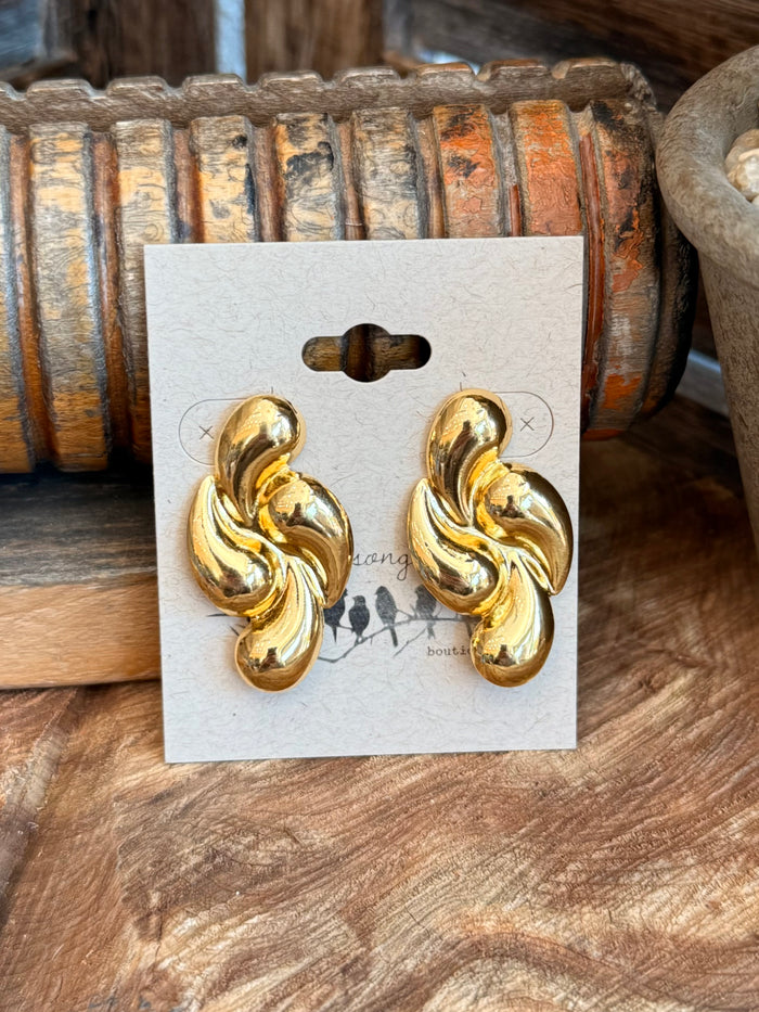 Gold-plated twisted teardrop stud earrings, close front on white card
