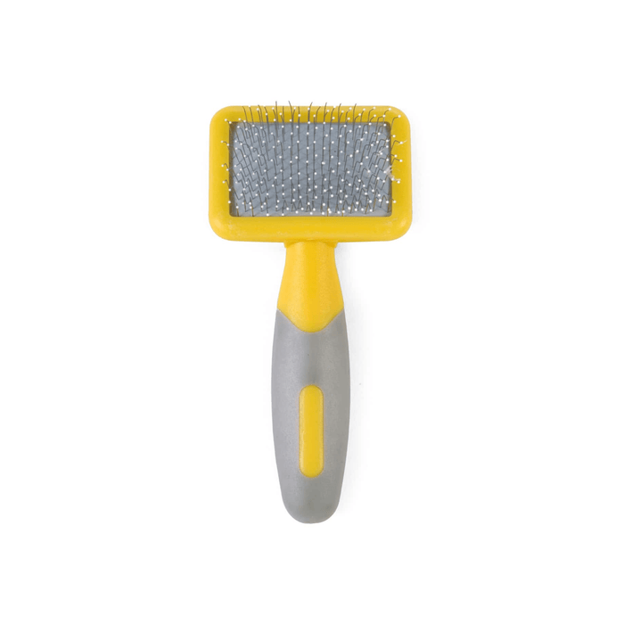 White background with a small animal Ancol yellow slicker brush with white tipped metal bristles and grey grips on the handle.