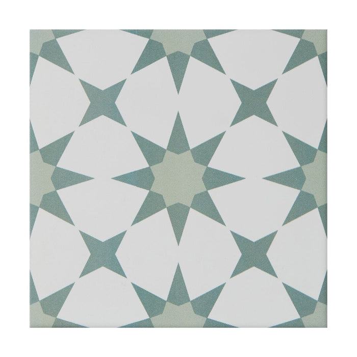 Geometric pattern tile with white and green shapes on a white background