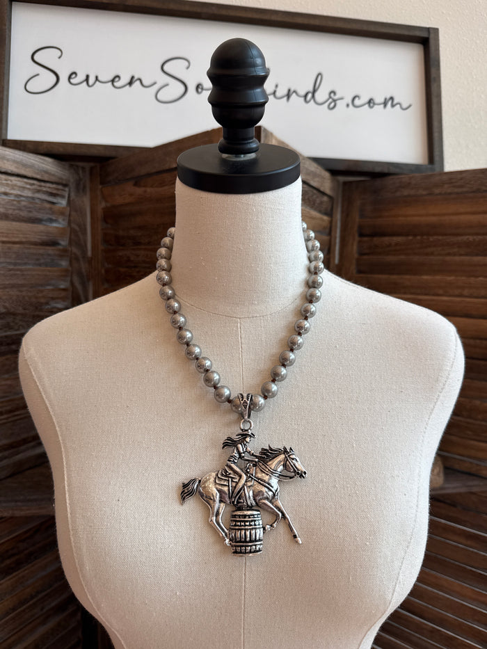 Silver-tone bead necklace with barrel racer horse pendant