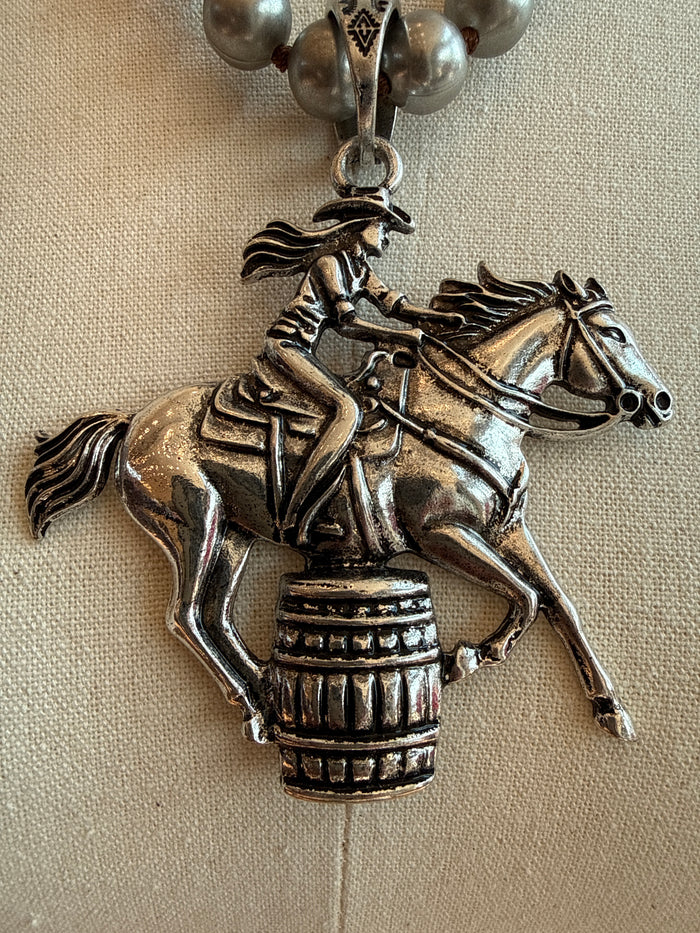 Silver-tone barrel racer horse pendant on a bead necklace