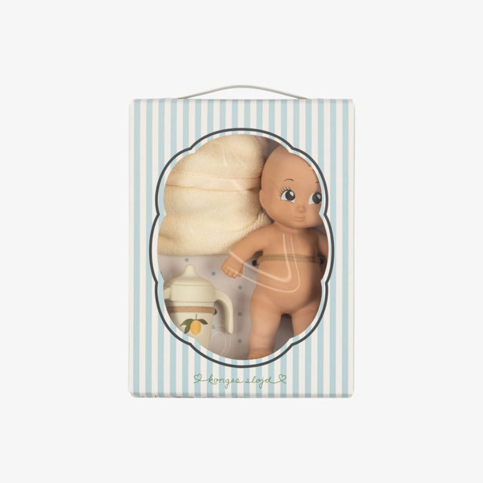 Wooden bath doll in a decorative box with striped background