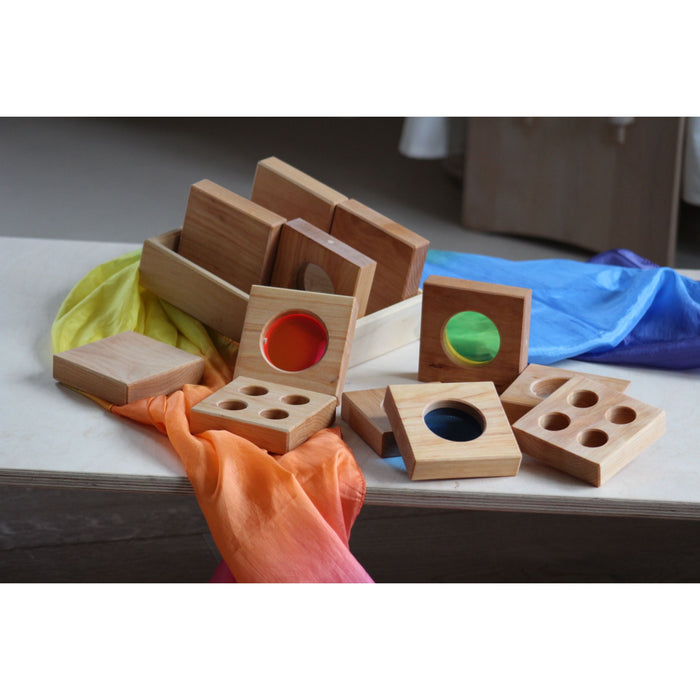 Wooden educational blocks with colorful interiors on a table