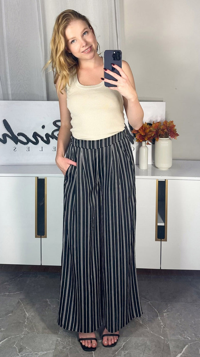 Black and white striped wide-leg pants with elastic waistband