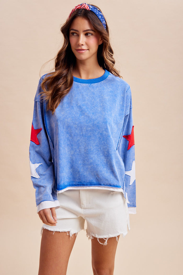 Blue cotton crewneck sweatshirt with star patches on both sleeves