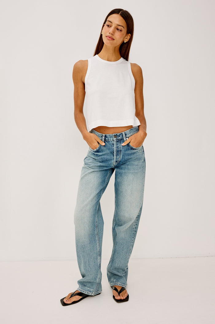 The Boxy Tank in 100% Cotton With Crew Neckline, Wide Shoulder Straps, and a Cropped, Boxy Fit in White Colorway - Full Body Front View Featured on Model