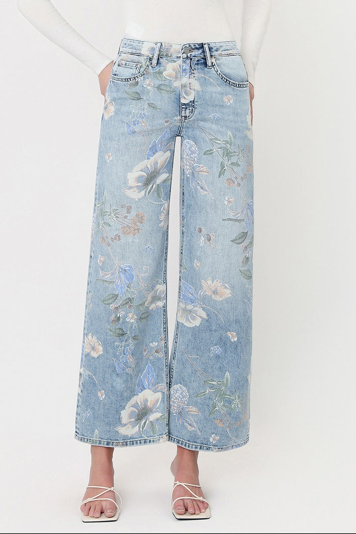 Floral light-wash denim jeans with wide-leg fit and front button closure