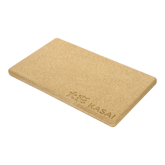 A beige rectangular heat mat with the brand 'KASAI' embossed on it.