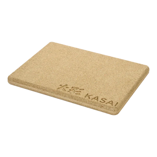A beige rectangular heat mat with the brand 'Kasai' printed on it.