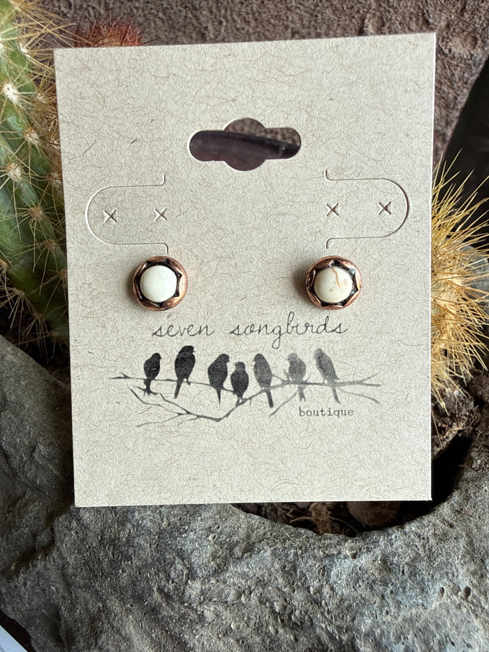 Mini stud earrings with round copper-toned bezels and dark center discs.