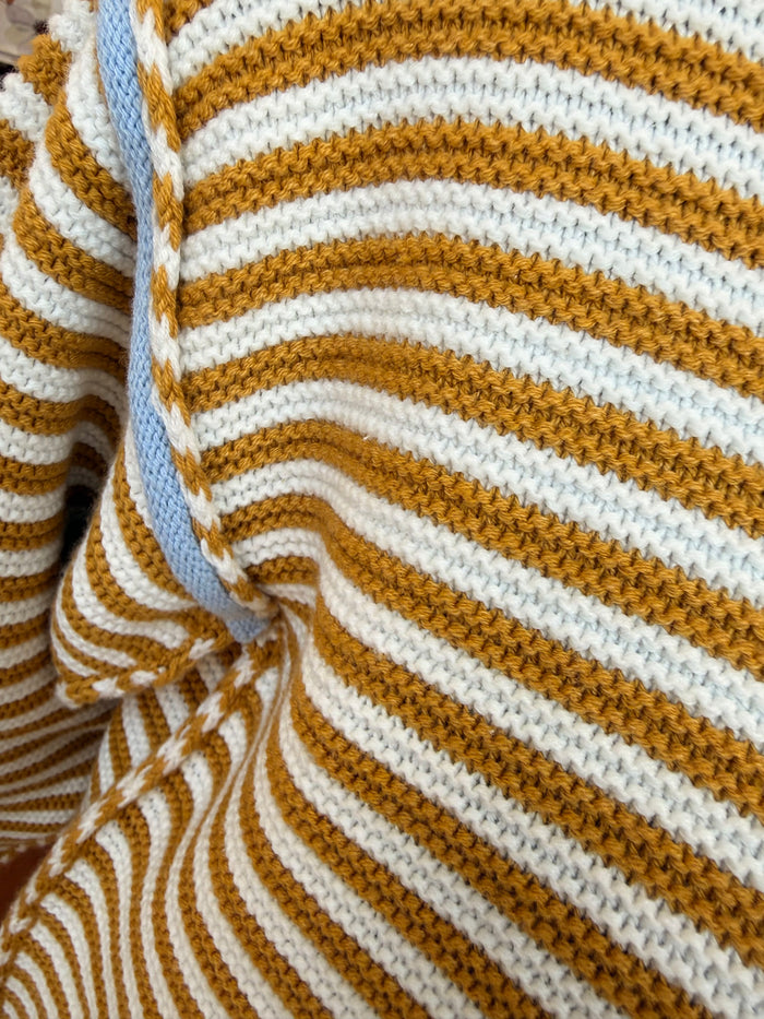 Striped crew neck knit sweater in mustard and white, ribbed cuffs and collar