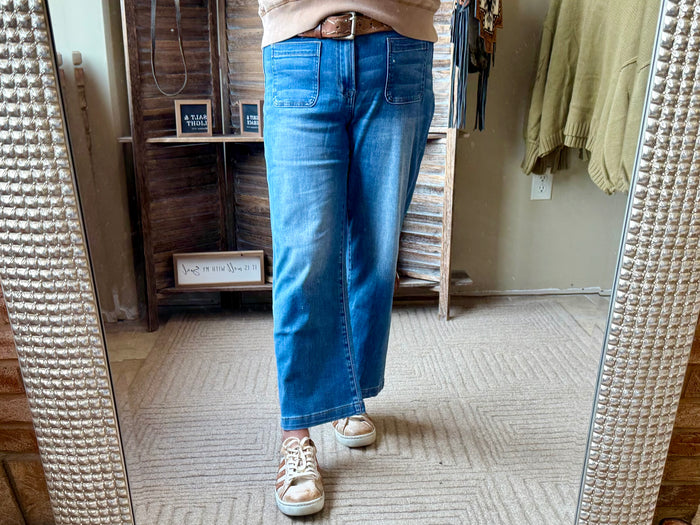 Blue cropped jeans with patch pockets and cuffed hem