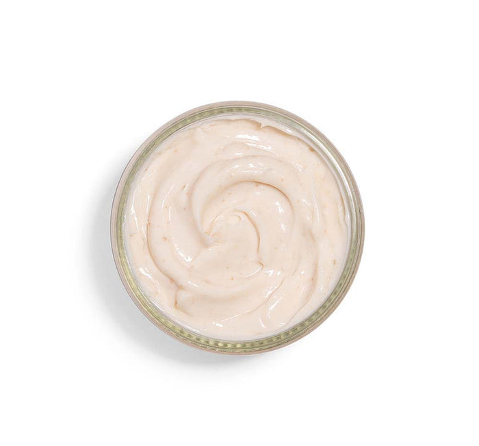 Top view of creamy textured skincare mask in a clear jar, featuring Pudding Apeel® Tapioca + Rice Active Fruit Glycolic Mask | FarmHouse Fresh for gentle exfoliation and glowing skin.