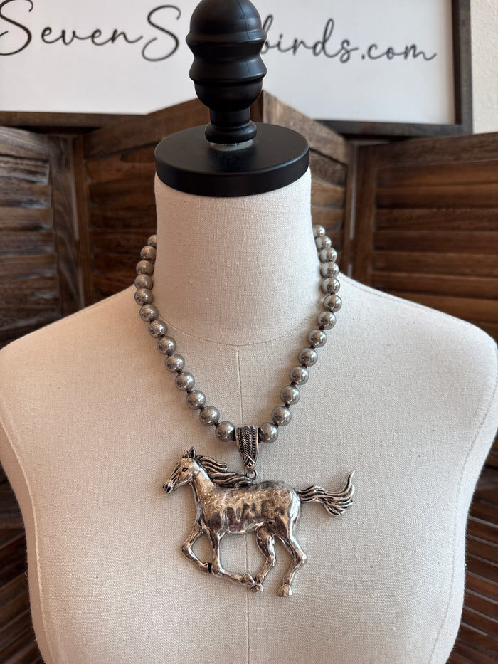 Horse pendant statement necklace with silver-toned bead chain on mannequin