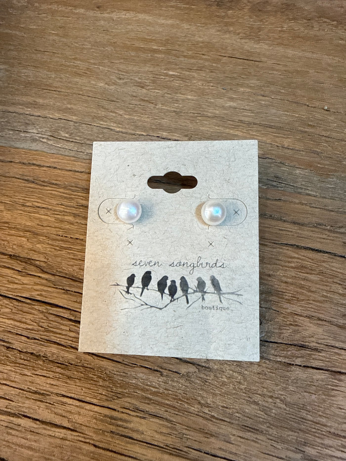 Freshwater pearl stud earrings with sterling silver posts, shown on a jewelry card