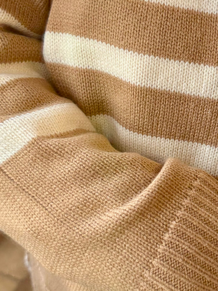 Tan and cream striped knit sweater close-up of crew neck ribbing and textured knit